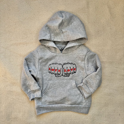 A small children's hoodie with a design reading "Love Love"