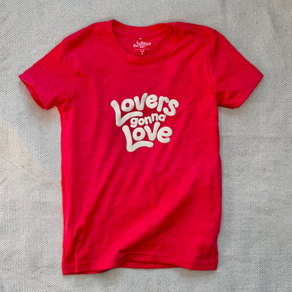 A youth size red hoodie that says Lovers Gonna Love