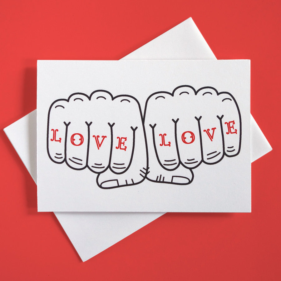 Greeting card with playful illustration of two fists that says "Love Love"